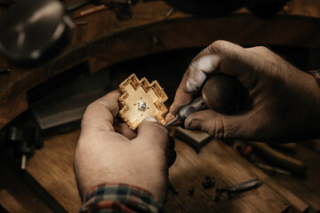 Different goldsmiths tools on the jewelry workplace. Jeweler at work in jewelry. Desktop for craft...