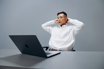 manager in a white shirt work laptop fatigue isolated background