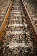 Train tracks, railroad tracks on gravel type ballast or kricak.