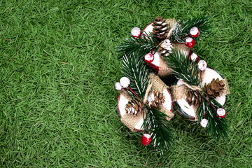 New Year's toys on the background of spruce needles. Scattered spruce needles. Background from showered spruce needles. 