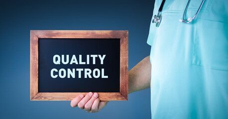 Medical Quality control. Doctor shows sign/board with wooden frame. Background blue