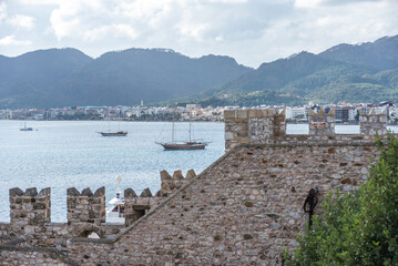 View of Marmaris castle and museum with small garden and Turkish flag on top, Marmaris, Turkey