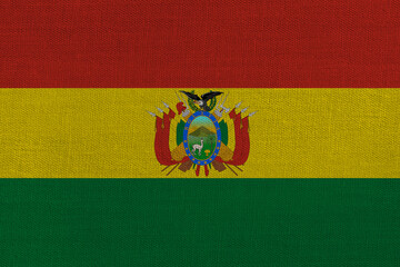 Fototapeta premium Patriotic textile background in colors of national flag. Bolivia