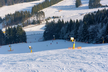 Ski slope at Slotwiny Arena ski station on a sunny day