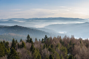 Fototapeta na wymiar Foggy view of Beskid Sadecki mountain range in Poland
