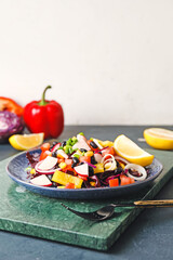 Plate of Mexican vegetable salad with black beans and radish on table