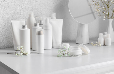 Different cosmetic products on light table