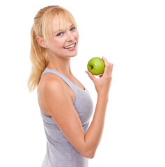 Everything I eat is good for me. Studio portrait of an attractive blonde woman holding an apple.
