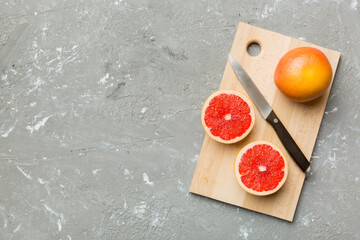 fresh Fruit grapefruit slices on colored background. Top view. Copy Space. creative summer concept....
