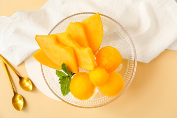 Dessert stand with tasty sorbet and melon pieces on beige background - obrazy, fototapety, plakaty