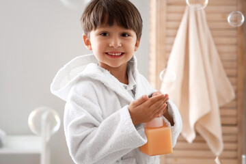 Cute little boy washing hands in bathroom © Pixel-Shot