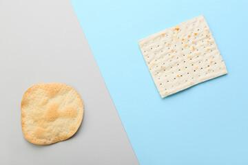 Different Jewish flatbread matza for Passover on color background