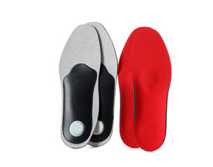 Different orthopedic insoles on white background