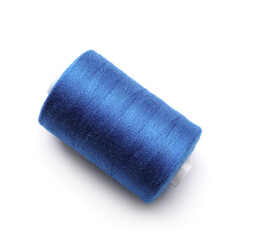 Blue sewing thread spool on white background