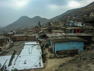 Houses of different construction materials in a low-income human settlement in Peru.