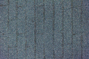 Macro abstract texture of sparkling silver glitter background with a faint vertical brickwork design pattern
