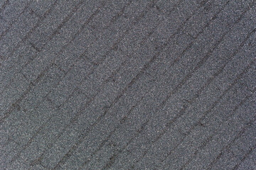 Macro abstract texture of sparkling silver glitter background with a faint diagonal brickwork design pattern
