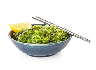 Bowl with healthy seaweed salad on white background