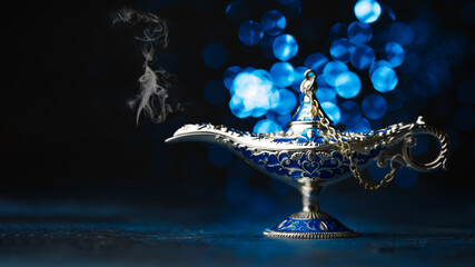 Vintage, beautifully decorated lamp. Fairy lamp of Aladdin. Isolated on dark blue fantasy...