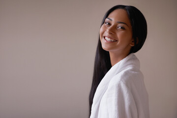 She ready for her relaxing massage. Studio shot of a beautiful young woman in a bathroom.