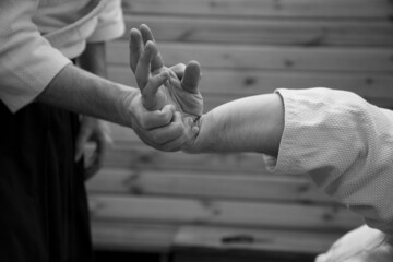 Martial Arts one hand grip close up in black and white