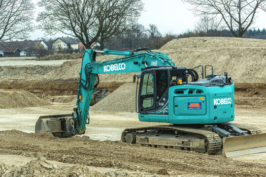 Pocking, Bavaria, Germany, 2022, March 6th: A Kobelco bagger on a construction site