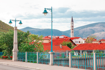 Naklejka premium Tiled roofs and mosque spire . Street of town in Bosnia and Herzegovina