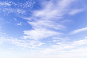 Obraz premium Beautiful soft gentle blue sky with many white cirrus and fluffy clouds, abstract background texture