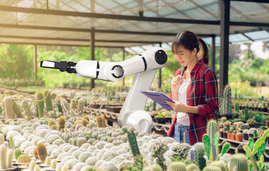 Robotic arm agriculture smart farm automation futuristic technology working with female farmer...