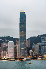 Illumination of Hong Kong Skyscrapers and Office Building with Victoria Peak Background at Sunset,...
