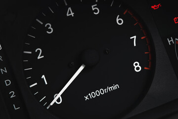 Close up shot of car dashboard. Speedometer on dial gauge. Automobile detail.