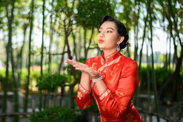 Asian pretty Chinese woman dress traditional cheongsam