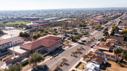 Obraz premium Afternoon aerial view of the downtown skyline and surrounding housing of Peoria, Arizona, USA.