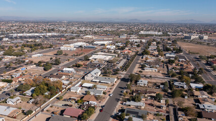 Fototapeta premium Afternoon aerial view of the downtown skyline and surrounding housing of Peoria, Arizona, USA.
