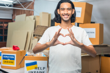 Volunteers preparing food donations for people in need in Ukrain., Humanitarian aid concept.Hands...