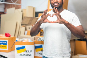 Volunteers preparing food donations for people in need in Ukrain., Humanitarian aid concept.Hands...