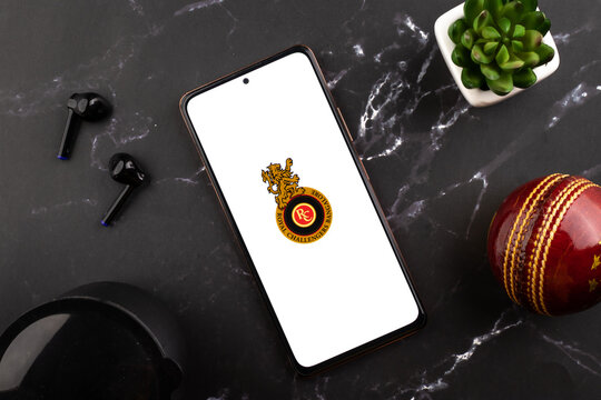 West Bangal, India - March 18, 2022 : Royal Challengers Bangalore logo on phone screen stock image.