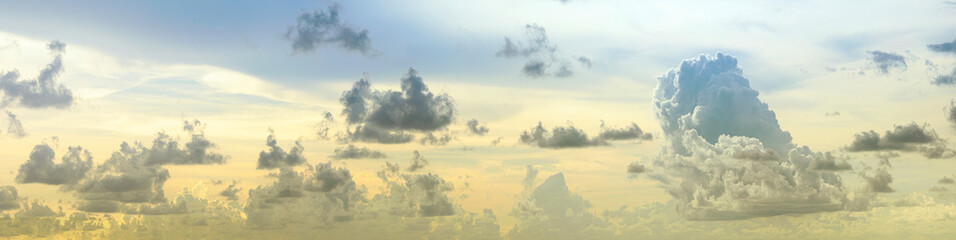 heaps of clouds in the sky at sunset panorama