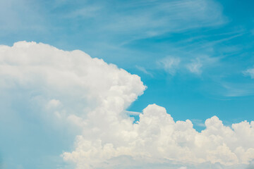 Blue sky and white clouds in cool color tone.