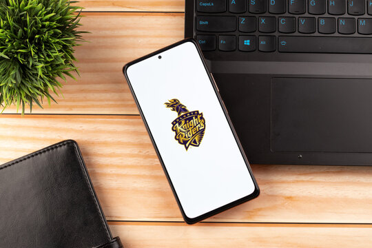 West Bangal, India - March 18, 2022 : Kolkata Knight Riders logo on phone screen stock image.