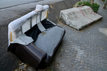 Closeup of Dirty Old sofas left on the side of the road, Selective Focus.