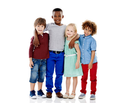 Embracing Diversity. Studio Shot Of A Group Of Young Friends Standing Together Against A White Background.