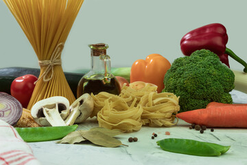 Dry and cheesy pasta with vegetables on the table
