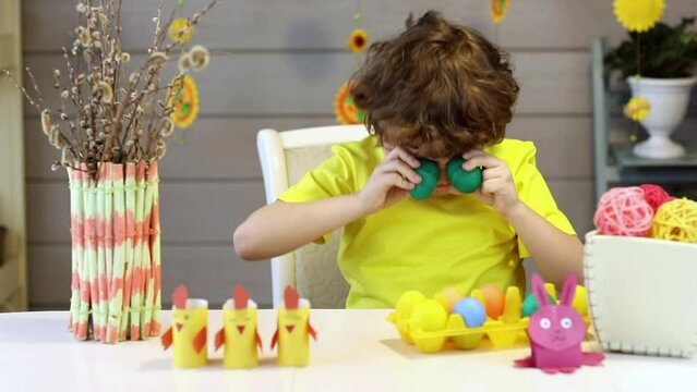 cute funny little boy with Easter painted eggs, easter concept