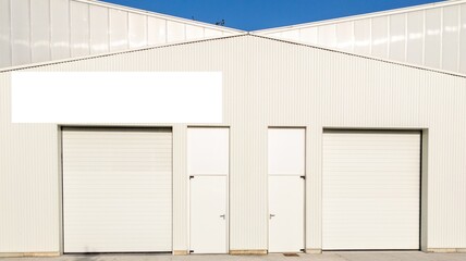 Empty white poster on warehouse store commercial industrial facade mockup entrance building