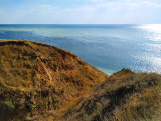 Big cave canyon in the Kherson region on the bank of the estuary. Stanislav clay mountains and canyons above Dnipro river bay near the Black sea, Ukraine. sandy hills