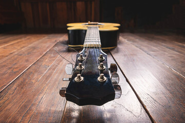 Acoustic guitar instrument on wooden background
