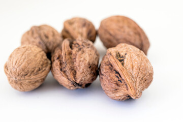 Shelled walnuts isolated on a white background.