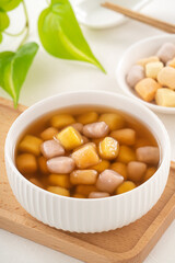 Delicious sweet taro ball soup in a white bowl for serving.
