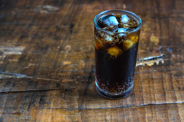 Cola drink, black soft drinks in a glass on the table